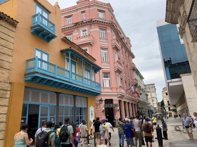 brightly colored buildings on a narrow street in Old Havana