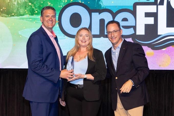 Katrina receives an award from her leaders