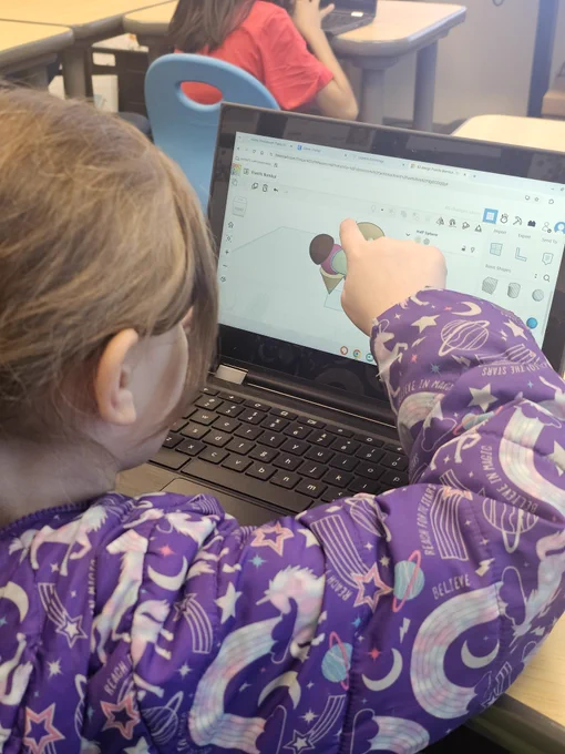 Designer using Tinkercad to create statue