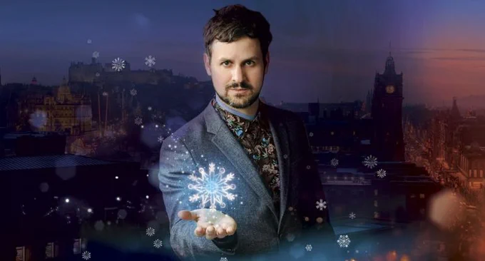 Photo of Edinburgh Magician Kevin Quantum holding a snowflake.