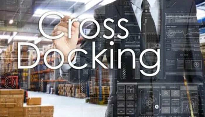 Business professional in a warehouse environment with the word 'Cross-Docking' overlaid, symbolizing cross-docking as a key lever to reducing warehouse costs and improving logistics efficiency.