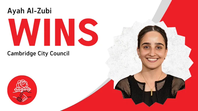 DSA-endorsed Ayah Al-Zubi wins 2025 Cambridge City Council seat! Ayah is pictured wearing a slightly edgy black dress shirt and gold necklace and grinning confidently.