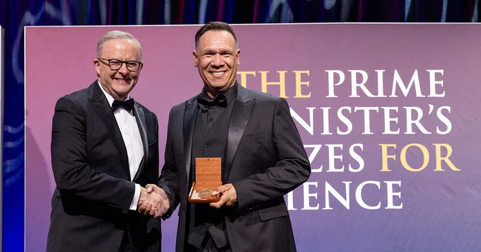 Michael Wear receiving his prize from the Hon Anthony Albanese MP, Prime Minister of Australia