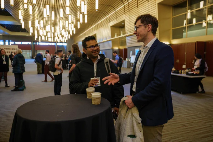 Attendees chatting during coffee break at the 105th Annual Meeting.