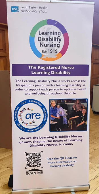 A vertical banner from the South Eastern Health and Social Care Trust featuring the logo "Registered Learning Disability Nursing" and text discussing the role of Learning Disability Nurses. The banner includes the NHS logo, a group photo of three nurses with a patient, and a QR code at the bottom for more information.