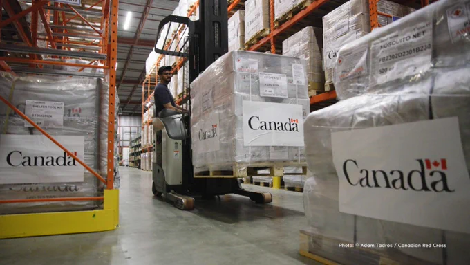 Boxes of Canadian humanitarian relief supplies stocked at a Canadian Red Cross warehouse. 