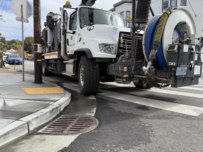 SFPUC rain ready crews clearing out a storm drain with the Vac-Con truck.