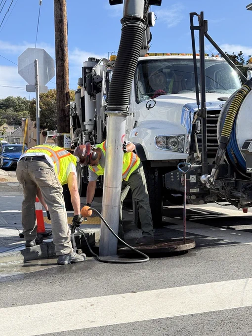 SFPUC rain ready crews clearing out a storm drain with the Vac-Con truck.
