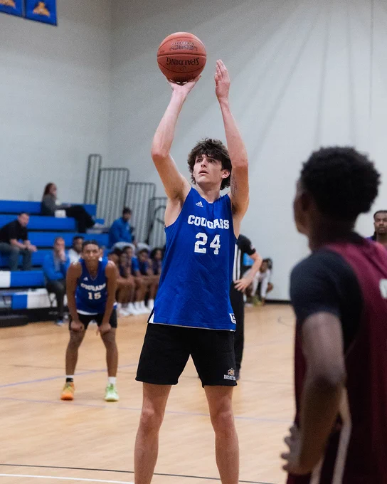 Basketball player shoots