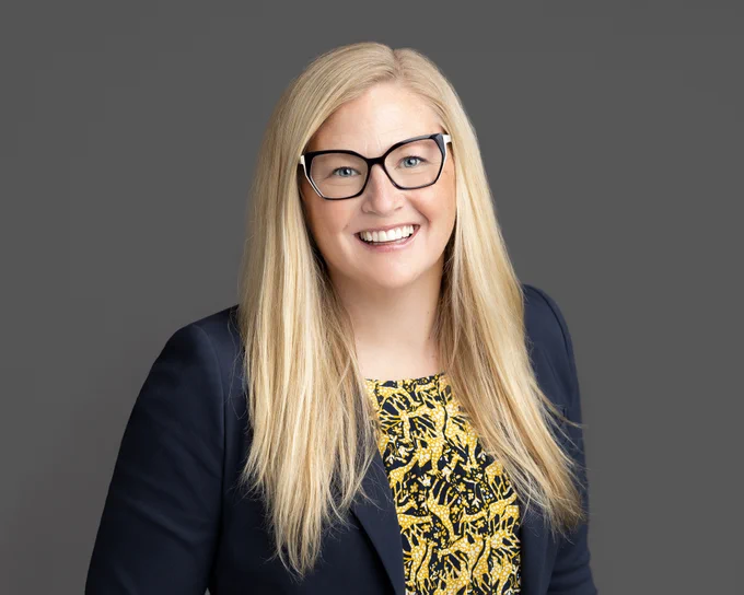 A portrait of Dr. Carly McMorris, University of Calgary ENHANCE Lab researcher, whose work centers on neurodevelopmental conditions and youth mental health.