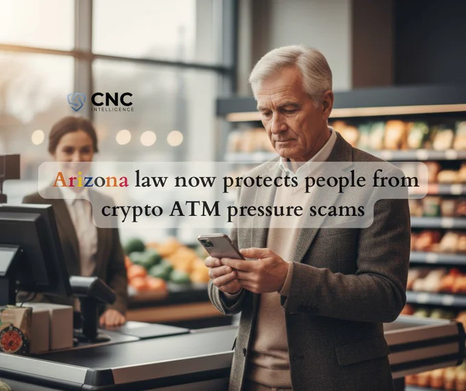 An older man stands at a grocery store checkout, looking thoughtfully at his smartphone. A cashier is blurred in the background, smiling gently. The image includes a message overlaid: “Arizona law now protects people from crypto ATM pressure scams,” with the CNC Intelligence logo in the top left corner. The scene conveys caution, awareness, and consumer protection.