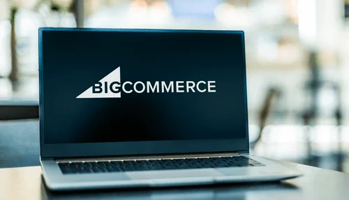 A laptop displaying the BigCommerce logo on its screen, symbolizing eCommerce technology and online store management related to Amazon and BigCommerce Integration.