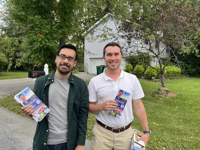Canvassing photo with Dutchess County Legislature candidate Trevor Redl. We’re outside in Town of Poughkeepsie. We’re holding palm cards.