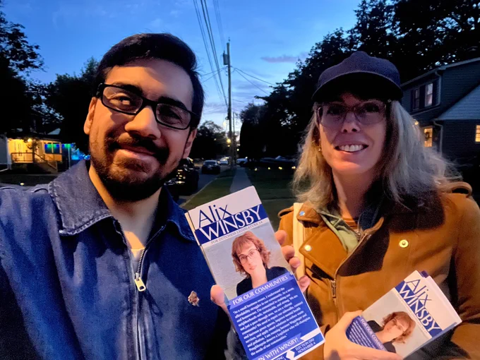 Canvassing photo with Dutchess County Legislature candidate Alix Winsby. We’re outside in Wappingers Falls. We’re holding palm cards.