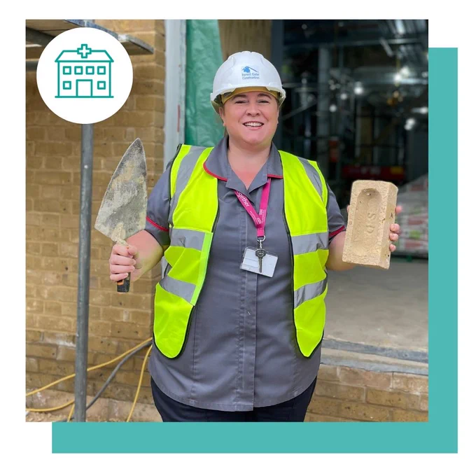 A member of staff laying a brick at Southend Hospital's new Emergency Department