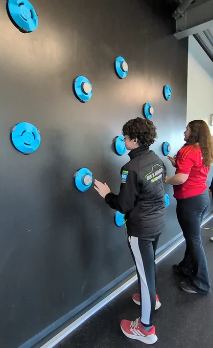 Photo of 2 students explored the reflex wall in the Maradyke Arena as part of their guided tour