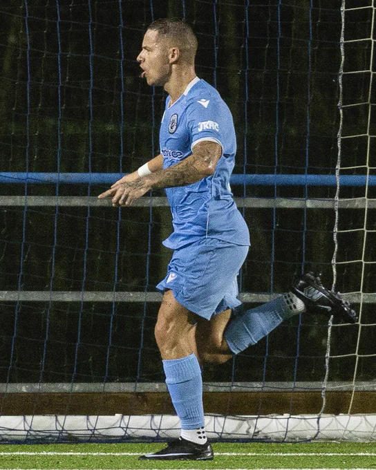 Calum Bateman celebrates scoring for Cambrian United against Briton Ferry Llansawel.