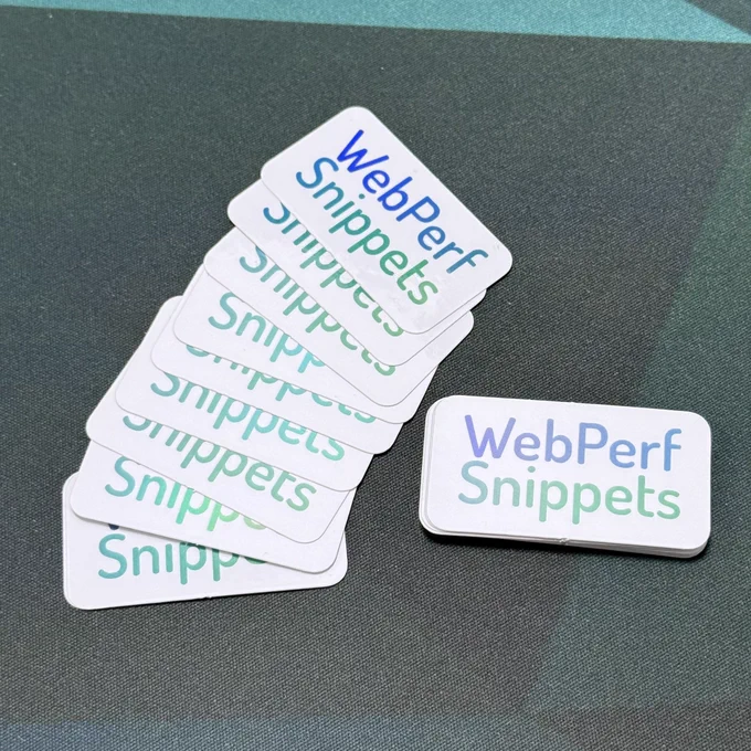 A collection of white rounded rectangular stickers displaying 'WebPerf Snippets' text in a gradient from blue to teal. Seven stickers are fanned out in a cascading arrangement on a dark gray textured surface, with one sticker placed separately to the right.