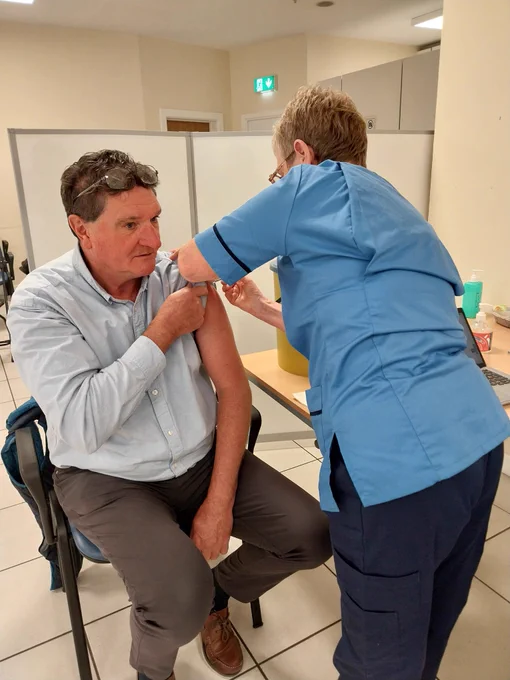 A man getting a flu jab