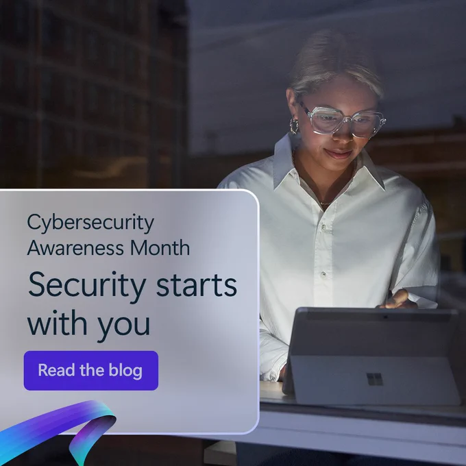 A person wearing glasses and a white shirt works on a tablet in a dimly lit office setting. A text box on the left reads: 'Cybersecurity Awareness Month – Security starts with you. Read the blog.' A blue and purple ribbon-like graphic appears at the bottom left of the text box.