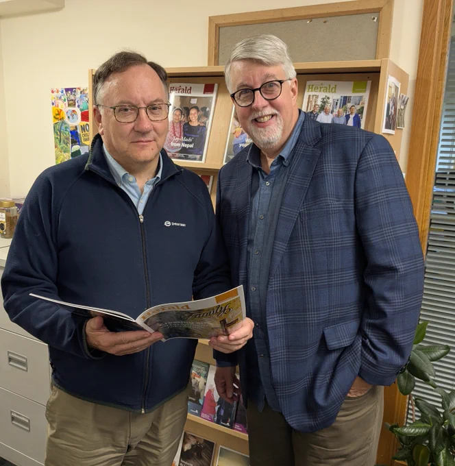 A photograph of the Moderator of the Presbyterian Church in Ireland (PCI), Right Reverend Dr Trevor Gribben (left) and the Stated Clerk of the Evangelical Presbyterian Church (USA), Rev Dr D. Dean Weaver having a look at the latest edition of the Presbyterian Herald in the Communications Department. The EPC (USA) became PCI's newest church partner at this year's General Assembly in June.