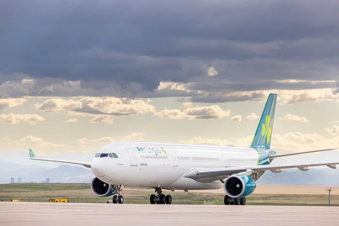 An Aer Lingus airplane taxis to the gate at DEN.
