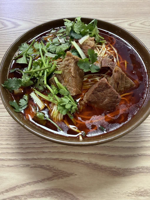 a big bowl of very tasty beef noodles, $2.15