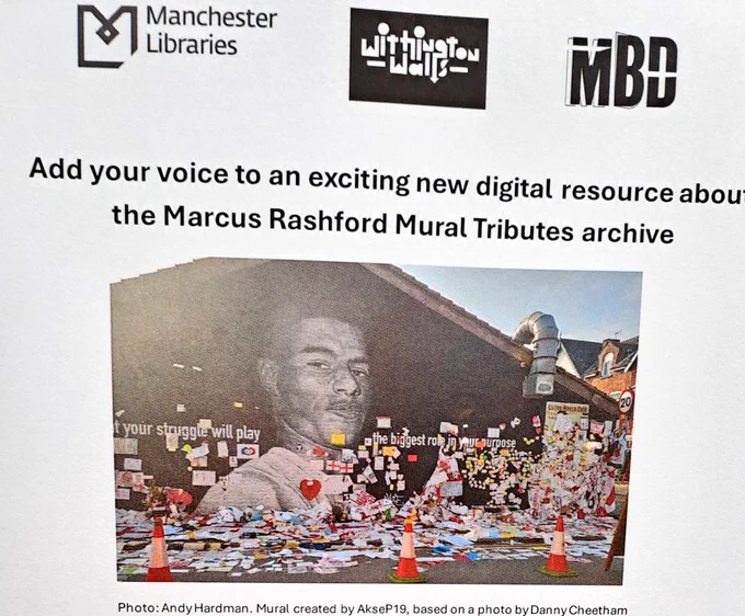 Photo showing mural of footballer Marcus Rashford with posters and messages overflowing on to pavement 