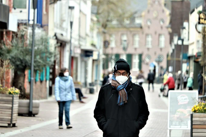 Photo of man wearing mask in street by Jeyaratnam Caniceus via Pixabay  https://pixabay.com/photos/man-face-mask-covid19-road-mask-6153671/