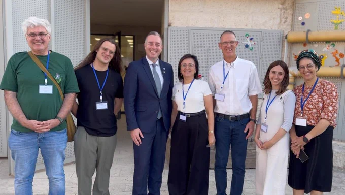 Image of Education Minister Paul Givan pictured with representatives from Ofek School and the Israeli Ministry of Education.