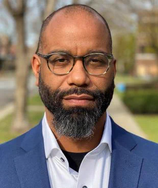 head shot of Dr. Reuben Jonathan Miller