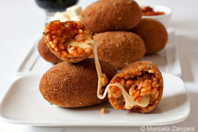 Crispy fried Italian rice balls filled with melted mozzarella.