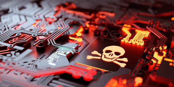 Pictorial representation of a gift card fraud campaign. A glowing skull and crossbones on a circuit board. 