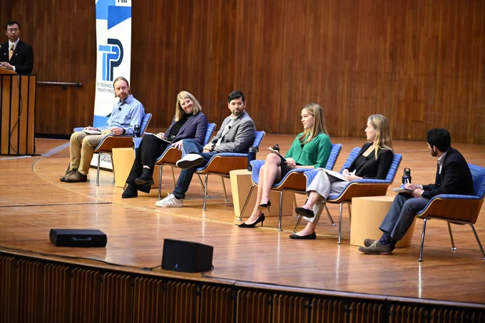 Panelists on stage. From l-r: Daniel Xue, Travis Franck, Tory Clark, Nestor Sepulveda, Erin Smith, Bethany Patten, Graham Turk