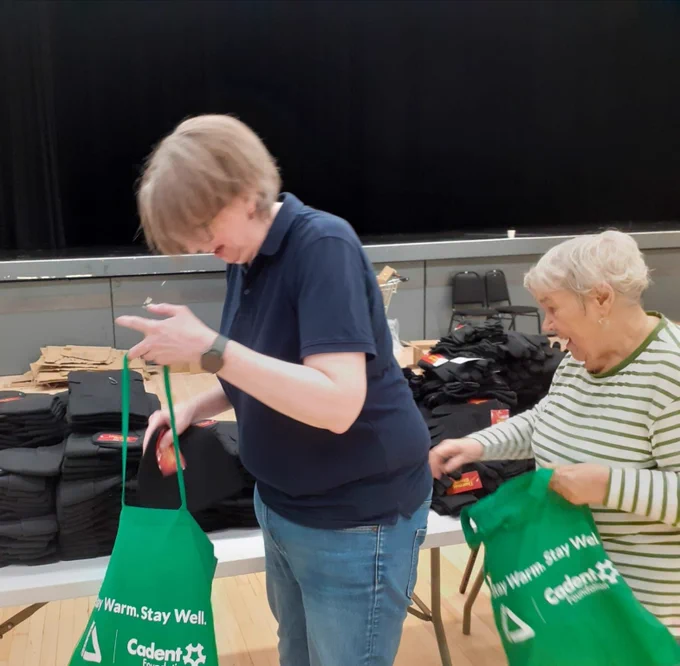 WGN's manager joins volunteers helping to pack Age Friendly Wythenshawe Winter Warmer Bags - going to vulnerable older adults in the local community. 