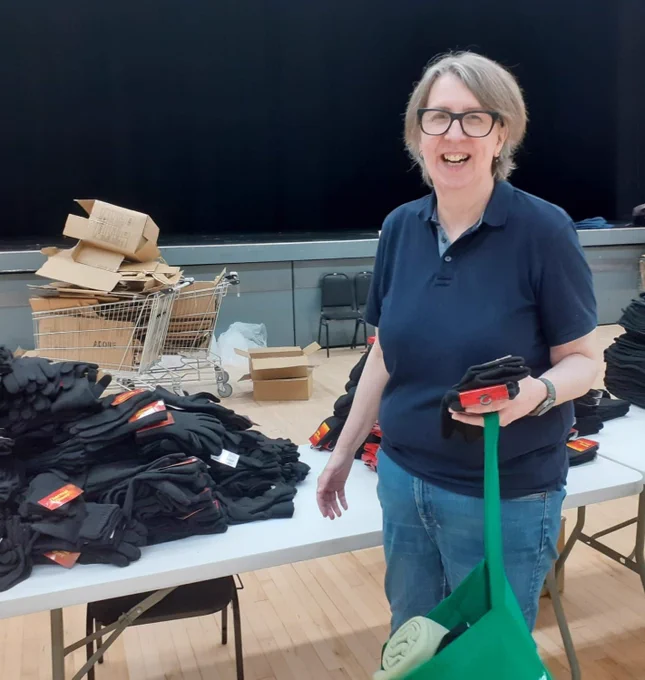 WGN's manager helping pack Age Friendly Wythenshawe Winter Warmer Bags - going to vulnerable older adults in the local community. 