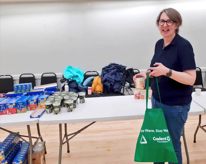 WGN's manager helping to pack Age Friendly Wythenshawe Winter Warmer Bags - going to vulnerable older adults in the local community. 