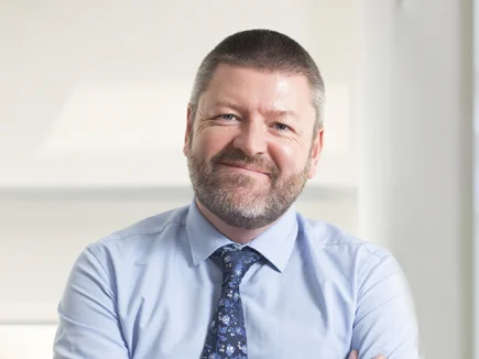 Portrait photograph of Barry McGinn