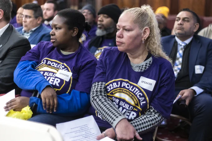 Community members from 32BJ SEIU sitting at a Committee on Consumer and Worker Protection hearing in Council Chambers.