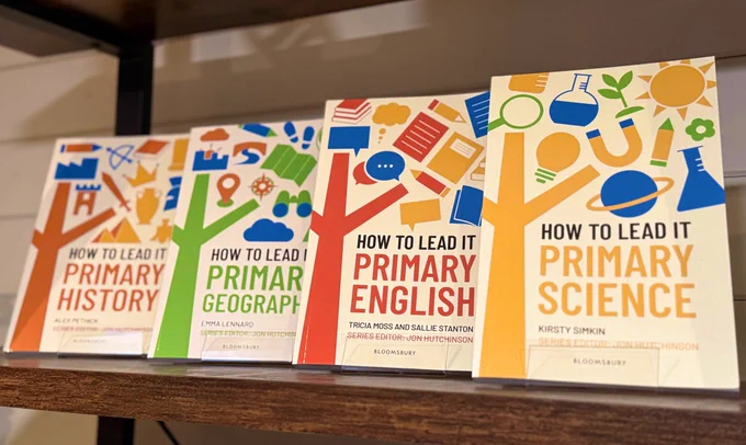 Four how to lead it books on a shelf.