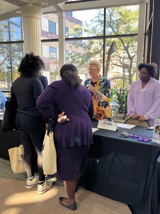 OOD participants talk with Adriana Hines, Education and Prevention Specialist, and Dawn Butler, Director of Human Resources from Hope and Healing Survivor Resource Center, about open positions.