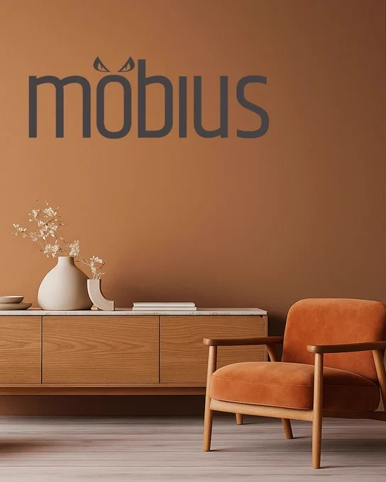 An autumnal pumpkin hued room with luxury velvet armchair in tonal shade and oak console table. The Mobius logo appears on the wall with scary eyes as umlaut's.