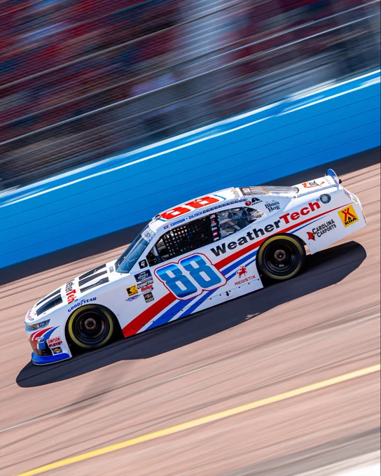 The No. 88 car races by at Phoenix.