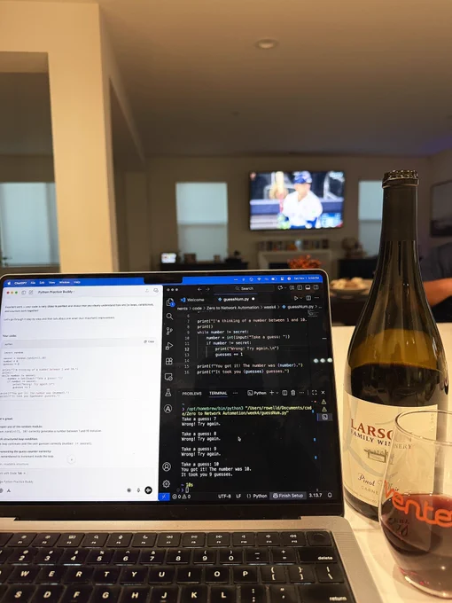Laptop with VS Code and ChatGPT open next to a bottle of wine poured into a Ventev branded glass.