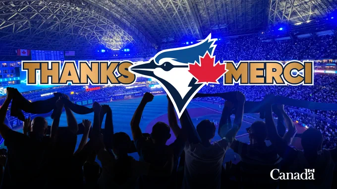 Silhouettes of cheering fans holding scarves inside a brightly lit baseball stadium with a closed roof. In the center, the Toronto Blue Jays logo with a red maple leaf is displayed between the words “THANKS” and “MERCI” in bold gold letters. The Canada wordmark appears in the bottom right corner.
