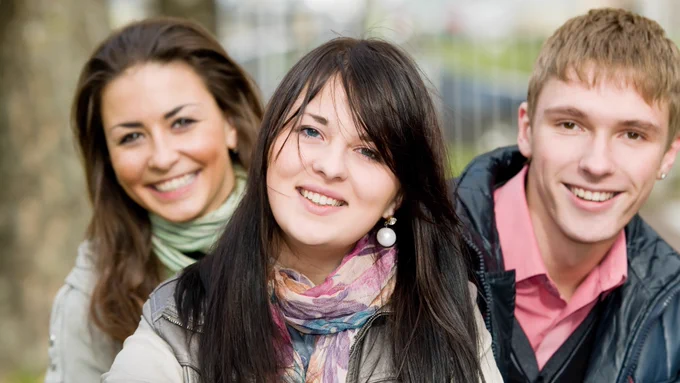 Three teenagers outside