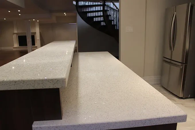 TWO LEVEL KITCHEN BAR WITH WHITE DOUBLE EDGE QUARTZ COUNTERTOP ✨🍽️

This elegant two-level kitchen bar features a stunning white double-edge quartz countertop that adds brightness, style, and modern sophistication to any home. The sleek design creates the perfect blend of beauty and function—ideal for cooking, entertaining, and everyday living. ✨ Whether you're dreaming of a refreshed kitchen or planning a full renovation, this design brings timeless luxury to your space. Upgrade your home today with quality craftsmanship and premium finishes! 🔨🏡