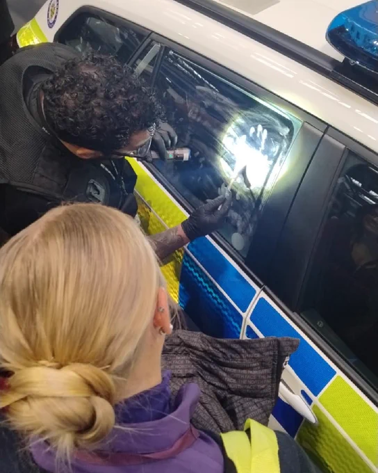 Forensics show finger prints on a police car