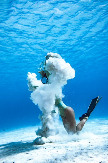 https://unsplash.com/photos/woman-in-black-and-blue-bikini-set-holding-white-smoke-6dP2M0Ws9Kw
