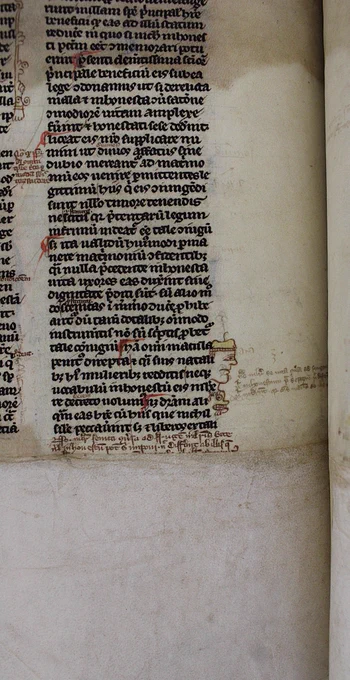 The doodle in beside the lower part of a right hand column of text. The man's cap is tinted yellow by the artist. Directly below his face is the creature or dog with gritted teeth, a wide eye, and what appears to be some drool from its jaw.